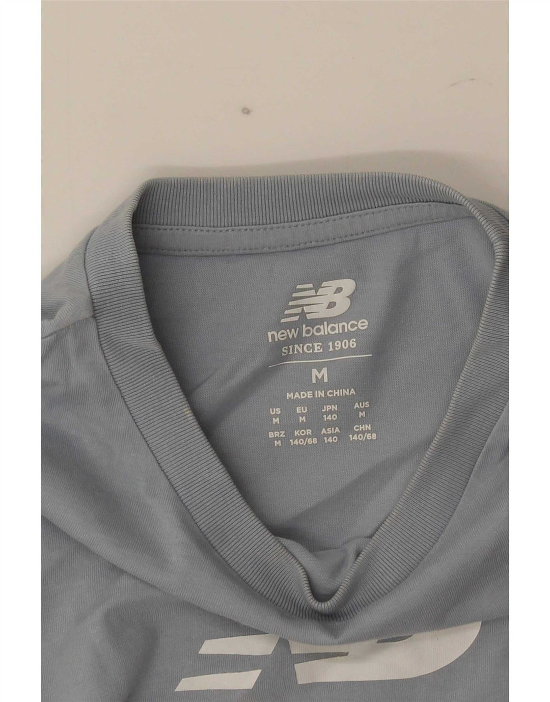 Chłopięcy T-shirt z grafiką New Balance 9-10 lat, średni niebieski