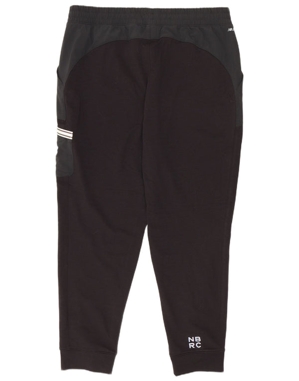 Męskie spodnie dresowe New Balance Joggery, duże czarne bloki kolorów
