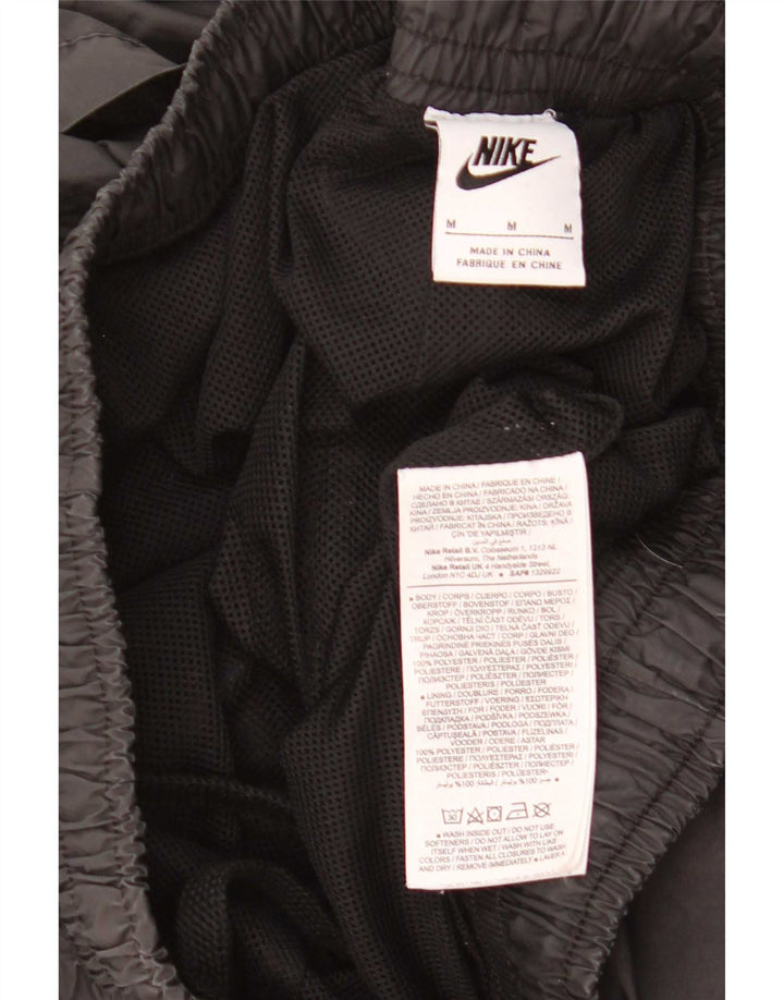 Męskie spodnie dresowe Nike z grafiką, średniej wielkości czarny poliester