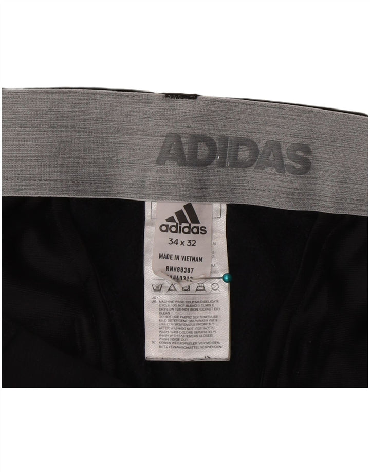Męskie spodnie Chino Adidas Slim W34 L32 Czarny poliester