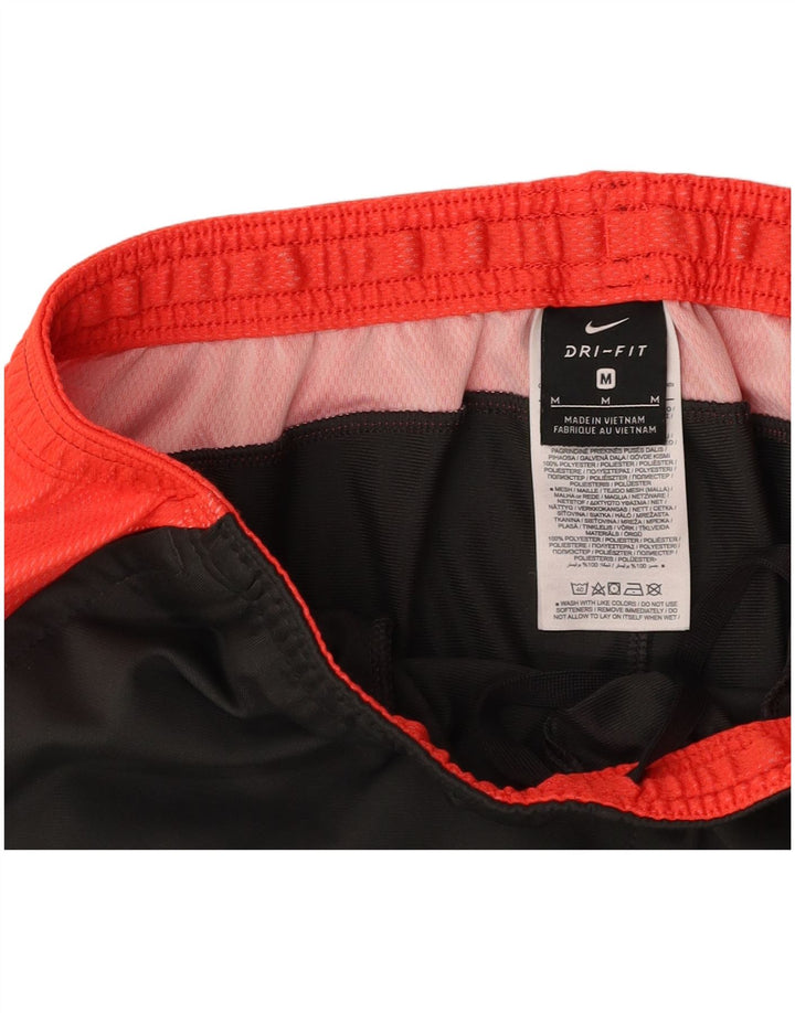 Męskie spodnie dresowe NIKE Dri Fit, poliester w kolorze średnioszarym