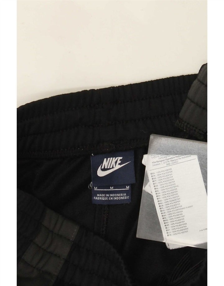 Męskie spodnie dresowe Nike Joggers, poliester w kolorze średniej czerni
