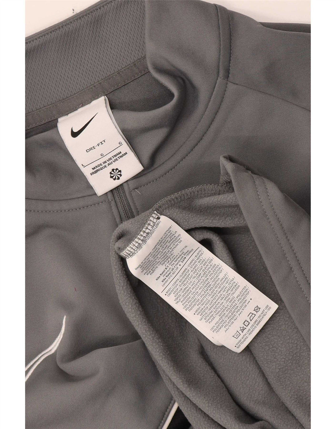 Męski dres Nike Dri Fit z zamkiem błyskawicznym i dużym szarym blokiem kolorów