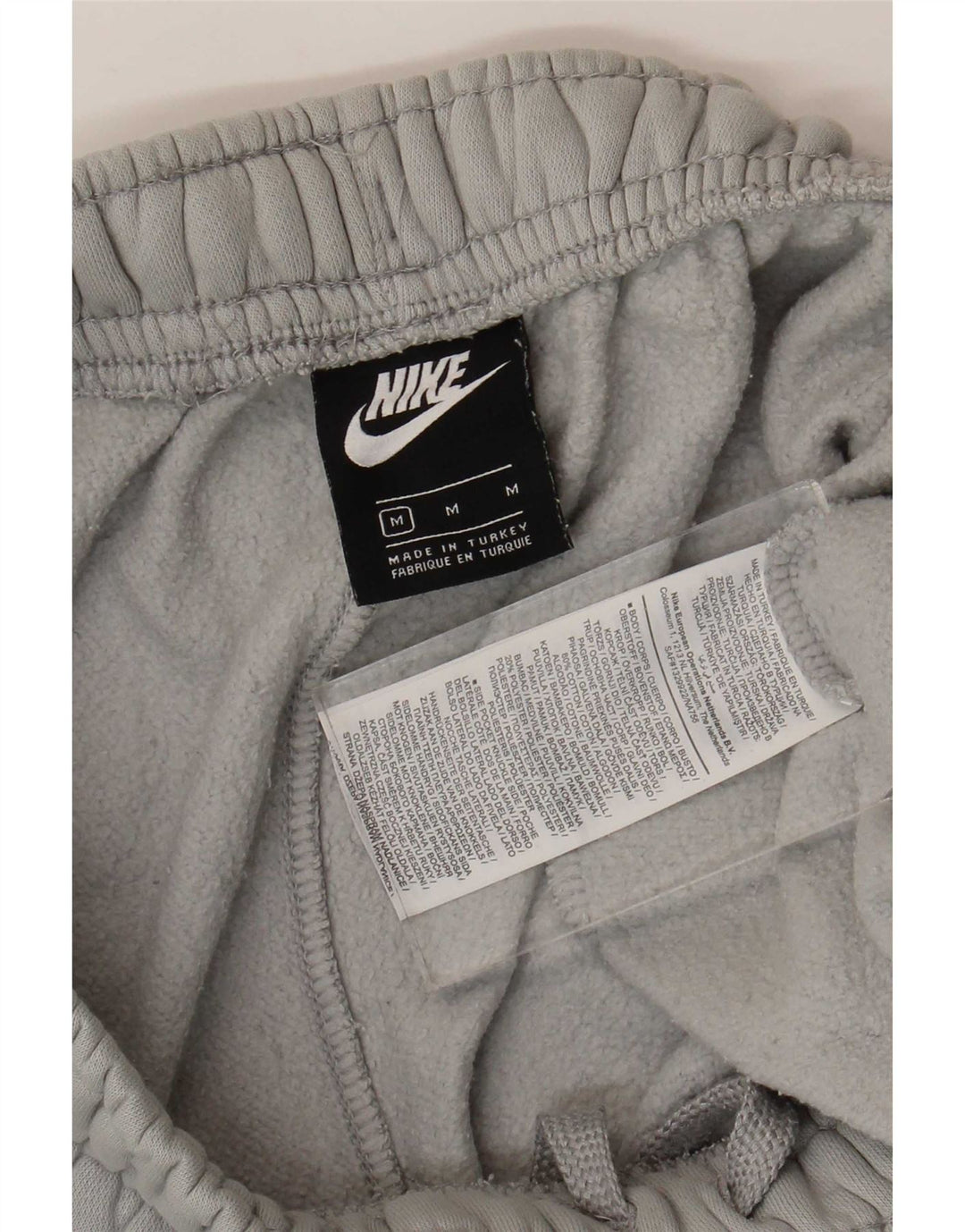 Męskie spodnie dresowe Nike Cargo Crop, średnioszare, bawełniane