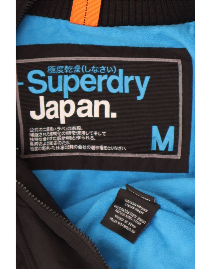 Damska kurtka wiatrówka z kapturem Superdry UK 14, średni czarny nylon