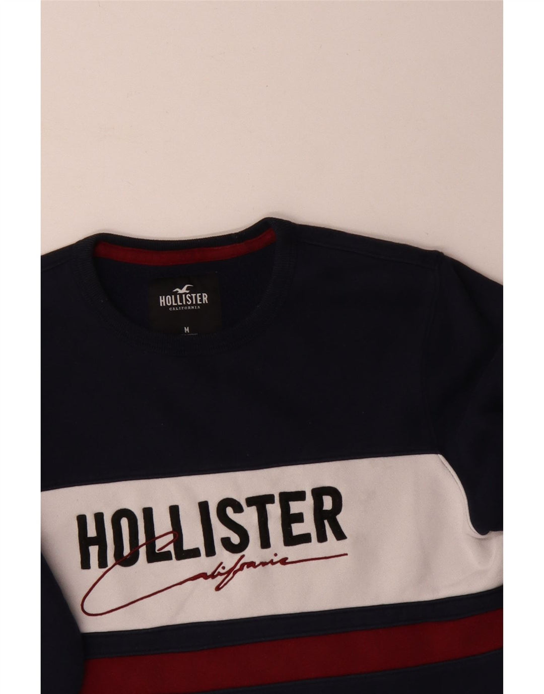 Męski sweter z grafiką Hollister, średni granatowy, blok kolorów