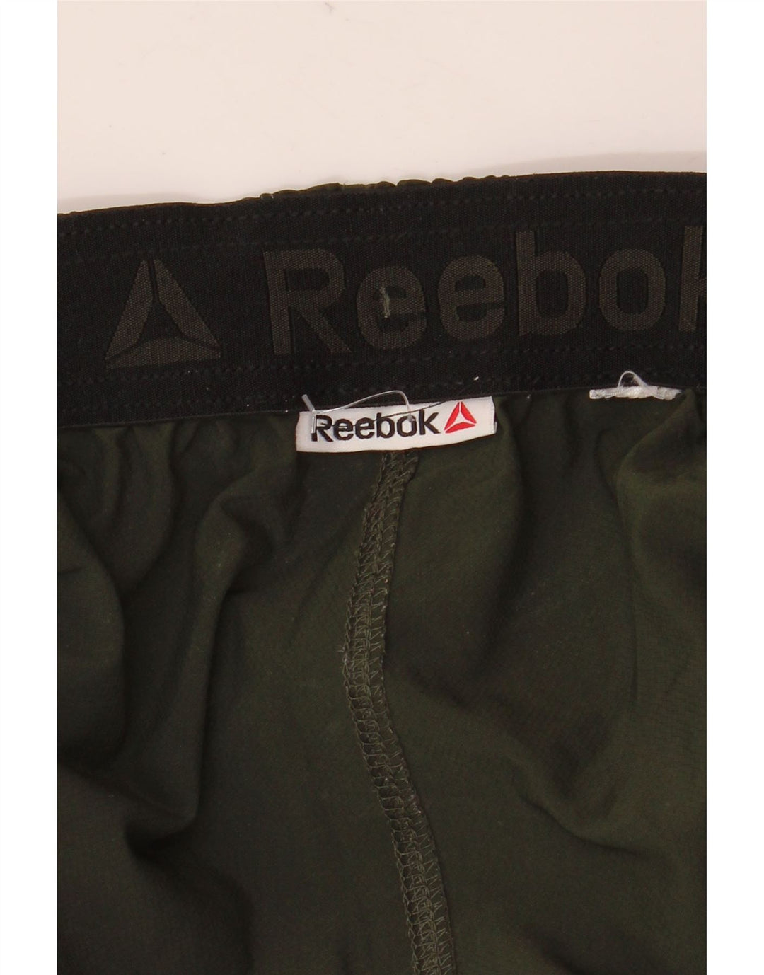 Męskie spodnie dresowe Reebok w kolorze średniozielonym