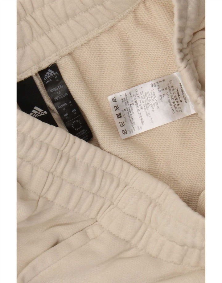 Męskie spodnie dresowe Adidas z grafiką, średnio beżowe, bawełniane