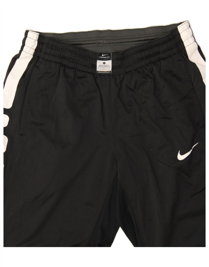 Męskie spodnie dresowe NIKE Therma-Fit, duży, czarny poliester z blokami kolorów