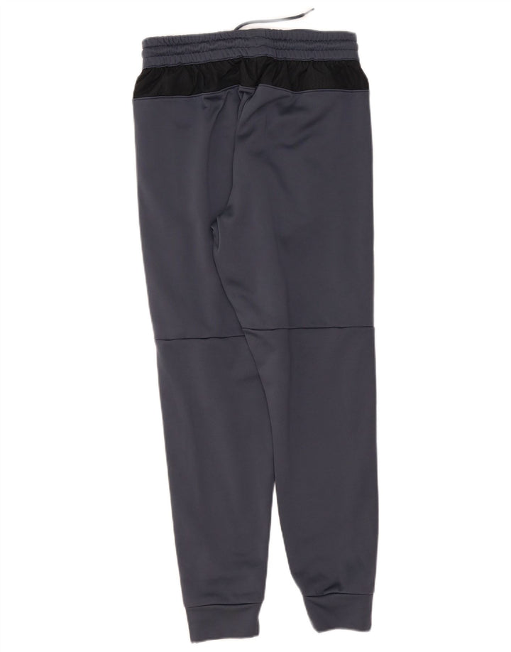 Męskie spodnie dresowe Under Armour Joggers w kolorze średnioszarym