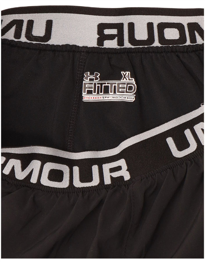 Dziewczęce dopasowane spodenki sportowe UNDER ARMOUR z grafiką 13-14 lat XL, czarne