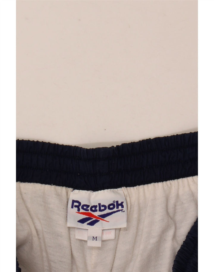 Męskie spodnie dresowe Reebok Joggers, średni granatowy nylon