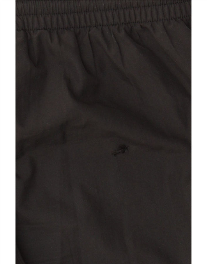 Chłopięce spodnie dresowe PUMA 15-16 lat, czarny poliester z blokami kolorów