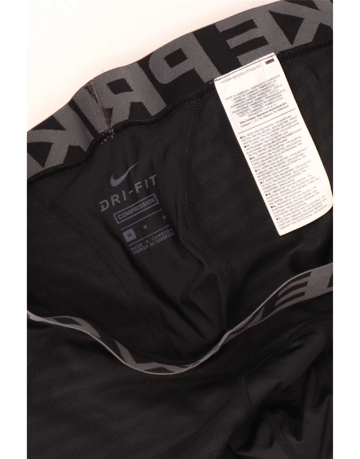 Męskie legginsy Nike Dri Fit z grafiką, poliestrowe średnie czarne paski