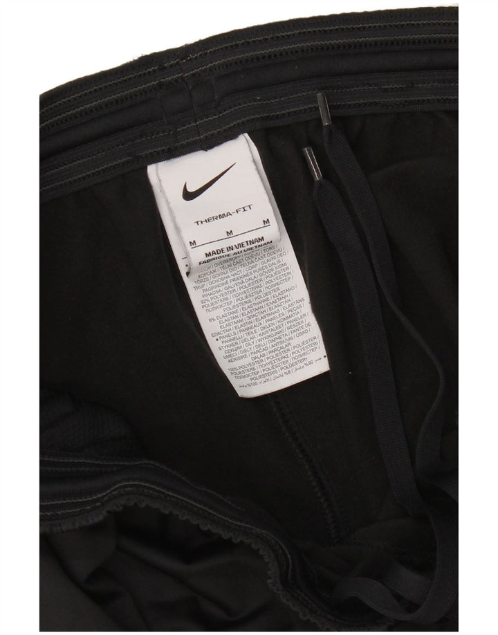 Męskie spodnie dresowe Nike Therma-Fit, średni czarny poliester