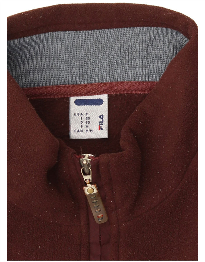 Męski sweter polarowy Fila z graficznym zamkiem i średnim brązowym kolorem