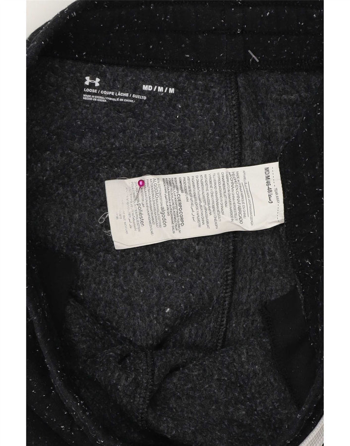 Męskie spodnie dresowe Under Armour z grafiką, średnie czarne nakrapiane