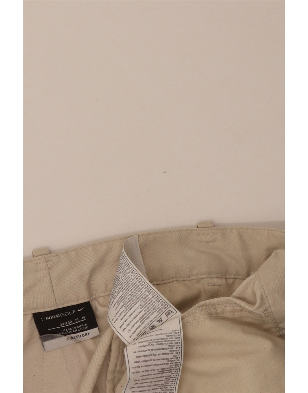 Męskie proste spodnie chino NIKE W34 L30 beżowy poliester