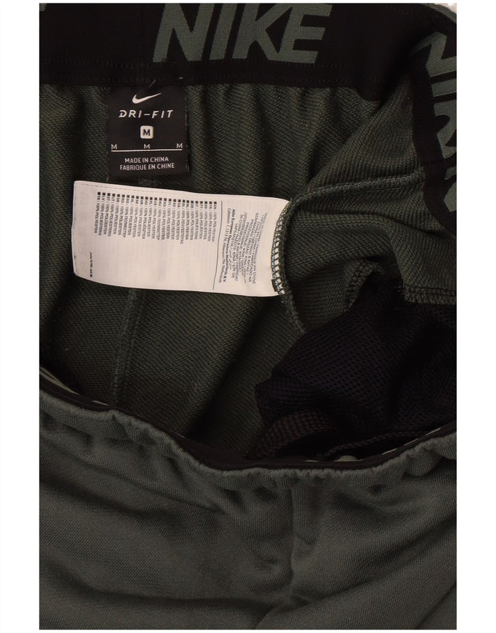 Męskie spodnie dresowe NIKE Dri Fit Joggery, średni zielony poliester