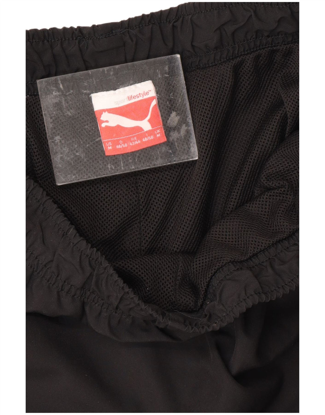Męskie spodnie dresowe PUMA Graphic Capri, średnio czarne