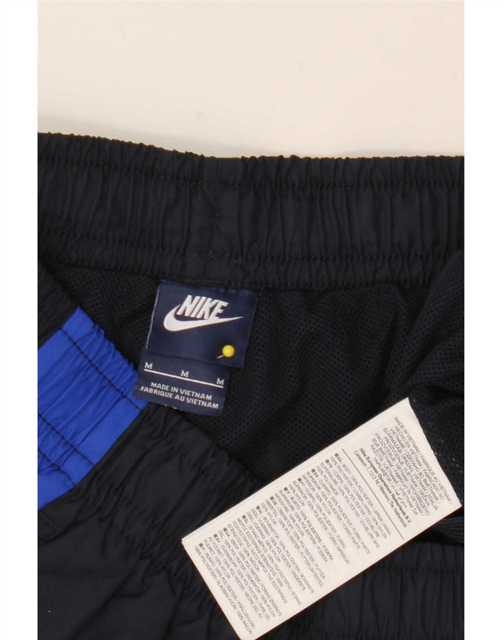 Męskie spodnie dresowe Nike, średni granatowy, poliester z blokami kolorów
