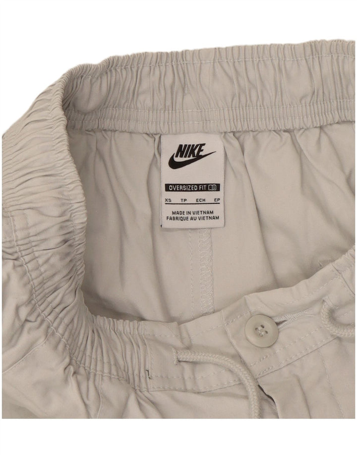 Męskie, oversize'owe spodenki chino Nike XS W26, biała bawełna