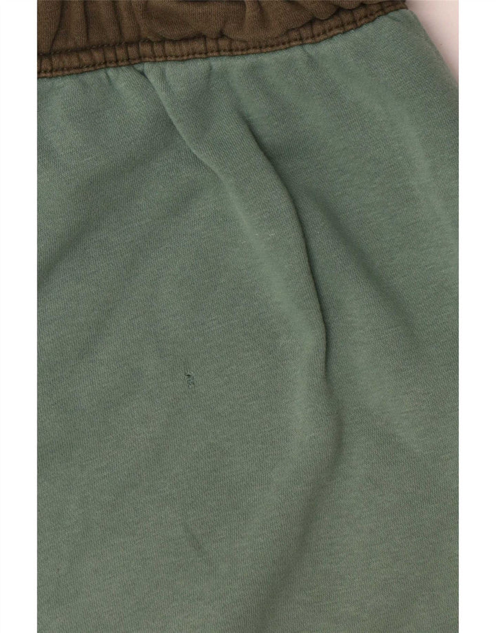 Męskie spodnie dresowe Nike Cargo Joggers w kolorze średniej zieleni