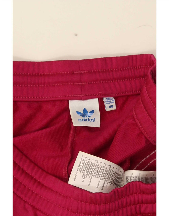 Damskie spodnie dresowe Adidas Joggers EU 40 Średni różowy poliester