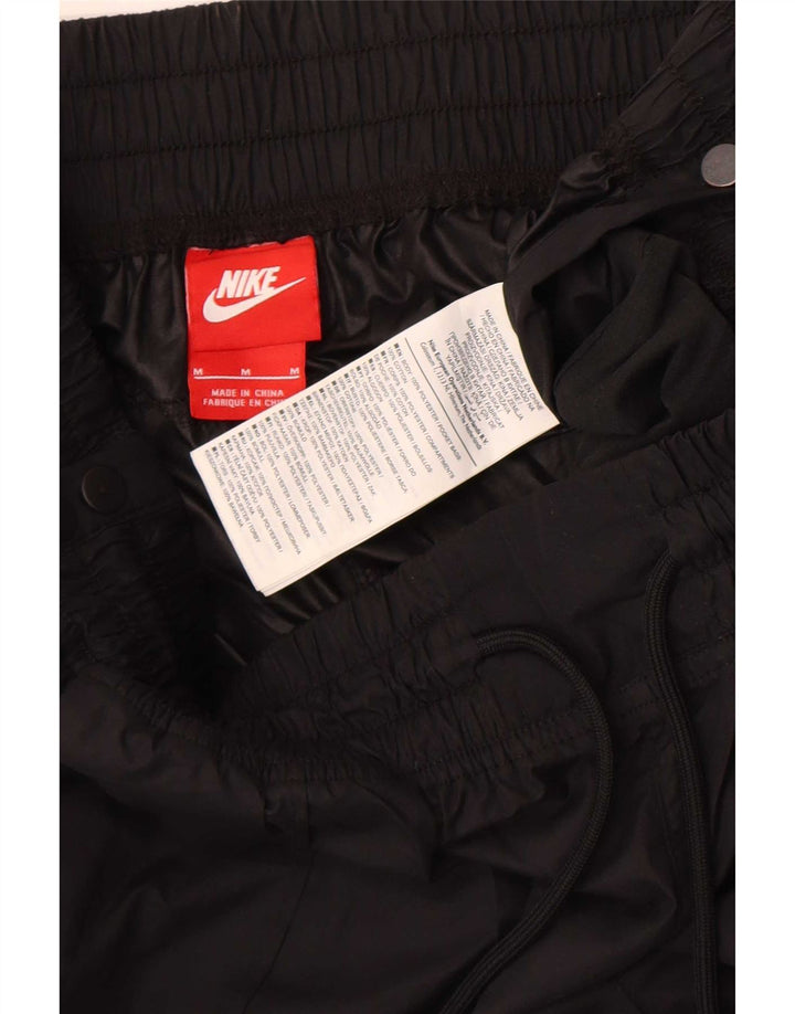 Wodoodporne spodnie damskie Nike UK 12, średni czarny poliester