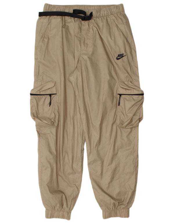 Męskie spodnie dresowe Nike Cargo Joggers, średni beżowy poliester