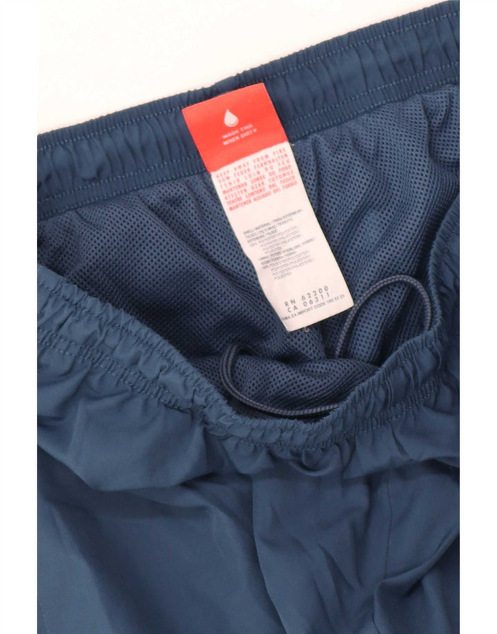 Męskie spodnie dresowe Puma Graphic Capri, średni granatowy poliester
