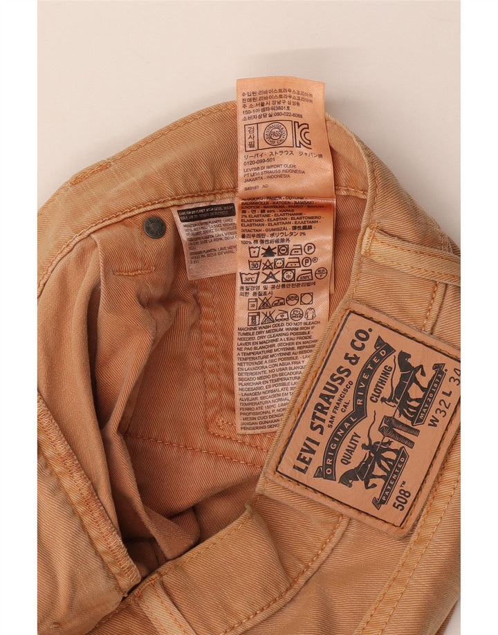 Męskie jeansy Levi's o regularnym kroju, zwężane W32 L34, beżowa bawełna