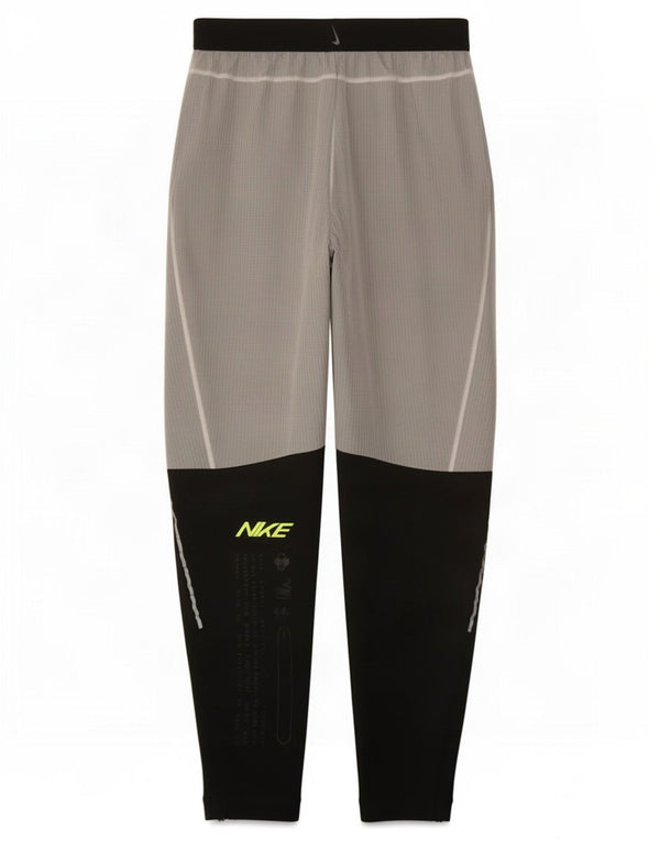 Męskie spodnie dresowe Nike Dri Fit Graphic, małe, szare, z blokami kolorów
