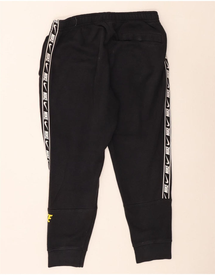 Męskie spodnie dresowe Nike Graphic Joggers, średnia czarna bawełna