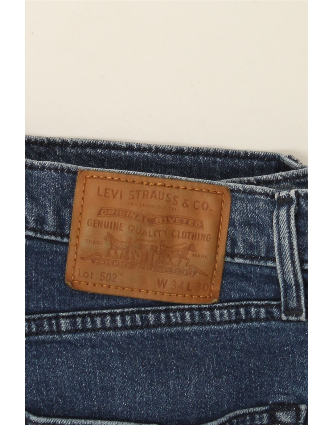 Męskie jeansy LEVI'S 502 zwężane W34 L30, niebieska bawełna