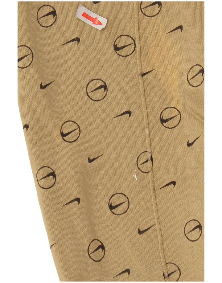 Męskie spodnie dresowe Nike z grafiką, małe, beżowe, geometryczne
