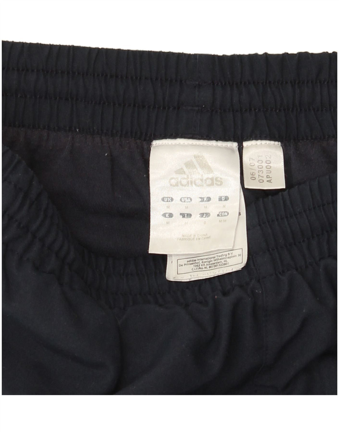 Męskie spodnie dresowe Adidas, średni granatowy poliester