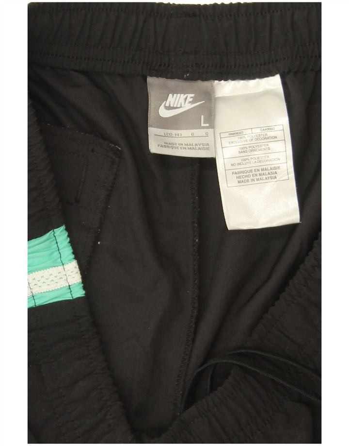 Damskie spodnie dresowe Nike Capri US 12/14, duże czarne bloki kolorów