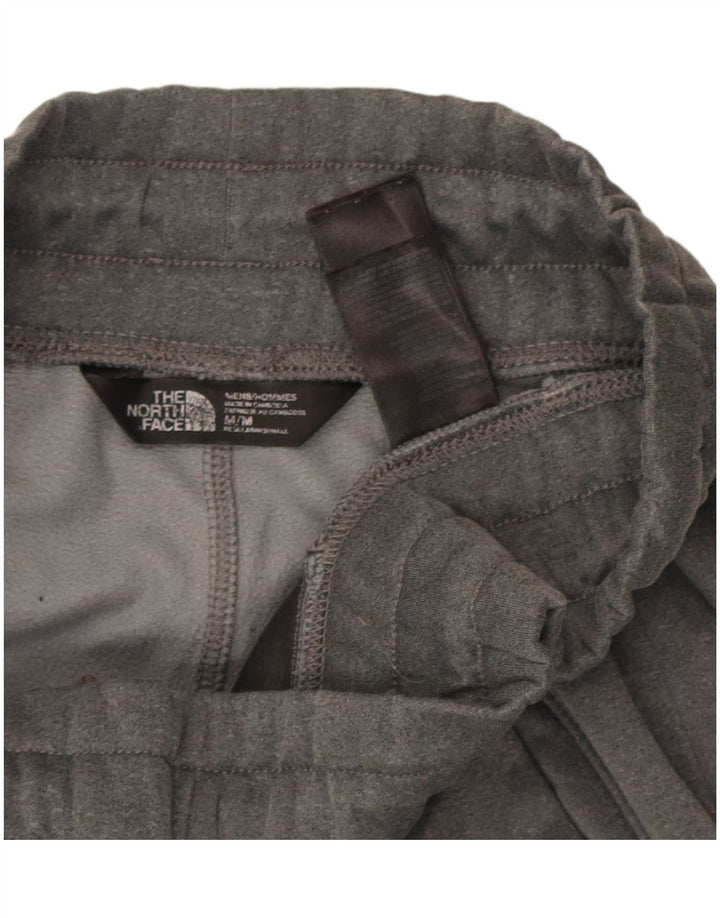 Męskie spodnie dresowe The North Face Joggery w kolorze średnioszarym, z poliestru