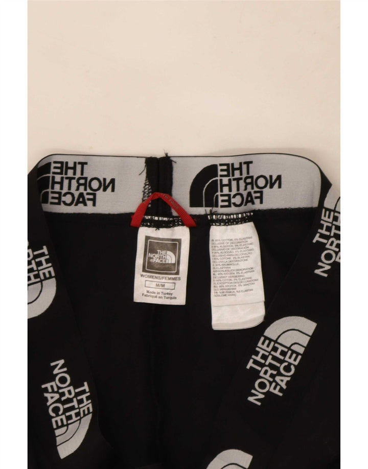Damskie legginsy graficzne The North Face UK 12, średnie czarne, bawełniane