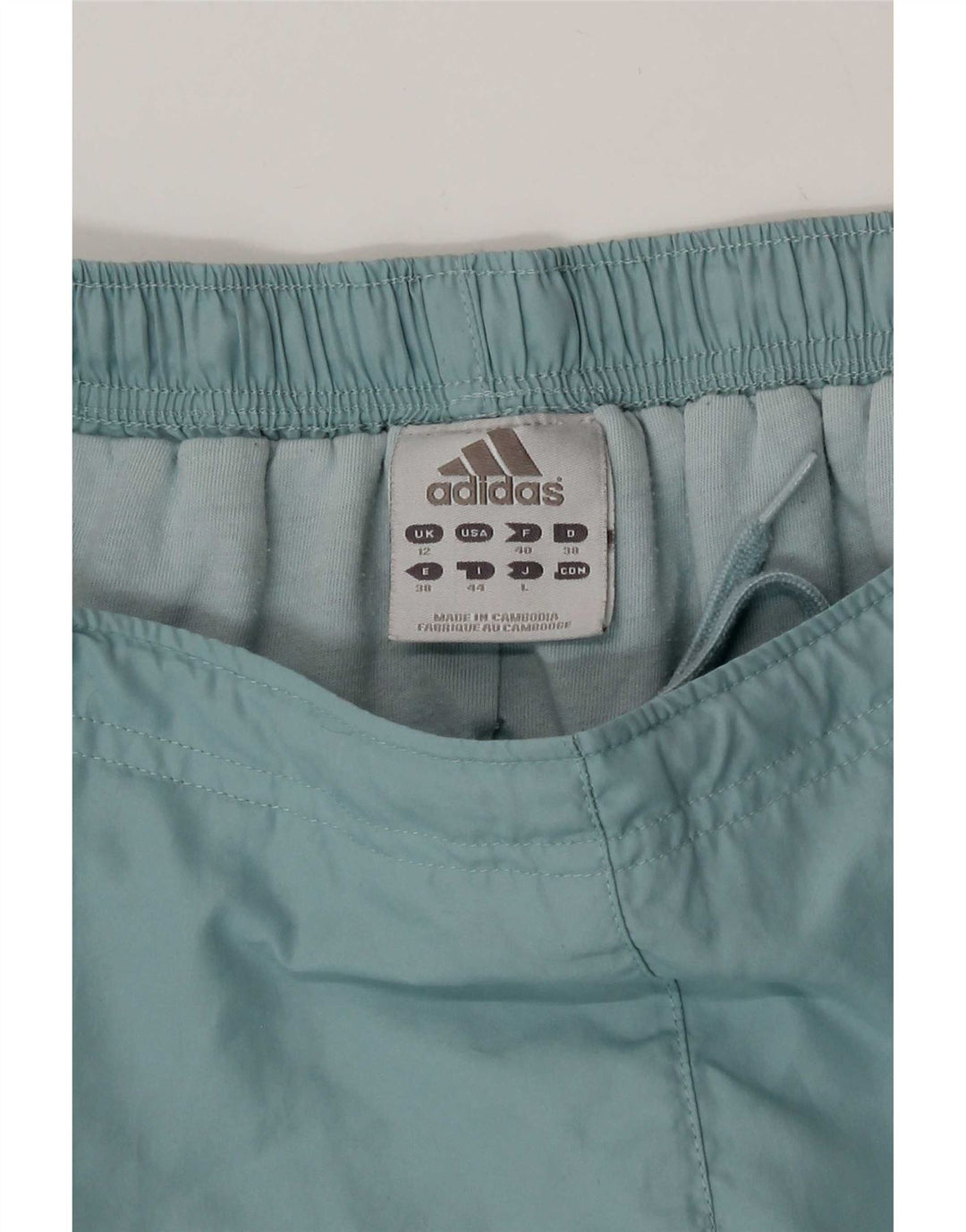 Damskie spodnie wiatrówkowe Adidas UK 12 Średni niebieski poliester