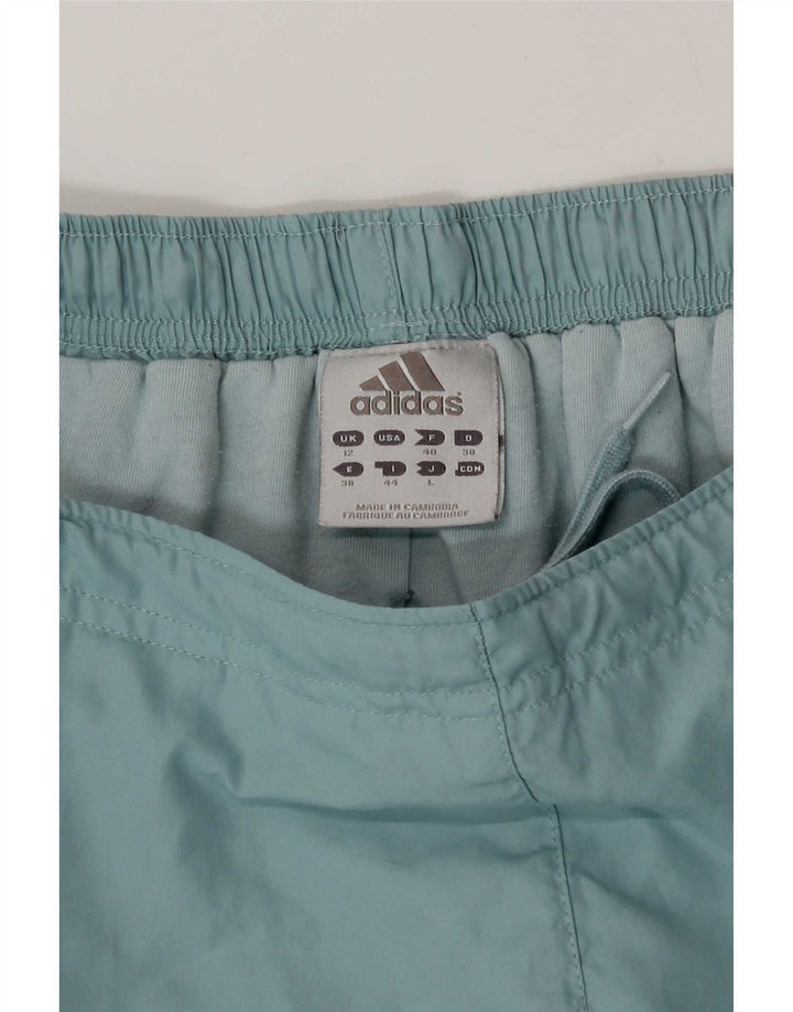 Damskie spodnie wiatrówkowe Adidas UK 12 Średni niebieski poliester