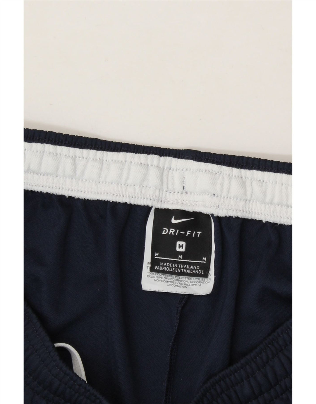 NIKE Mens Tracksuit Trousers Medium  Navy Blue Colourblock Polyester Vintage Nike and Second-Hand Nike from Messina Hembry 