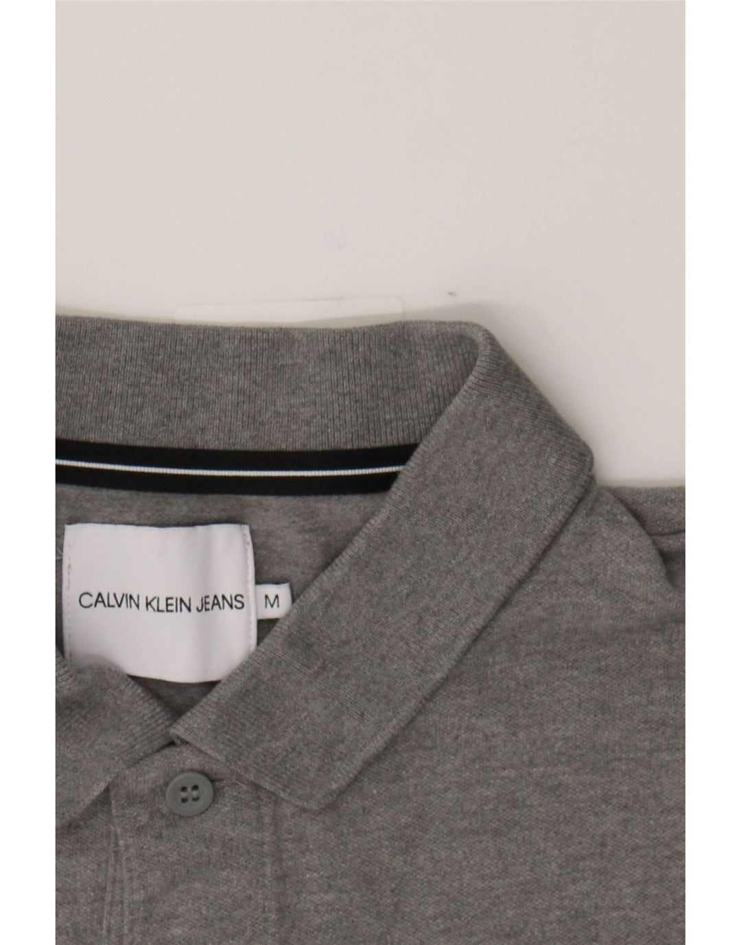 CALVIN KLEIN JEANS Mens Graphic Polo Shirt Medium Grey Cotton Vintage Calvin Klein Jeans and Second-Hand Calvin Klein Jeans from Messina Hembry 