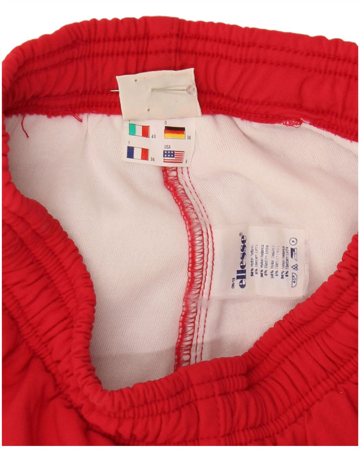 Damskie spodnie wiatrówkowe Ellesse Stirrup US 6, średni czerwony nylon