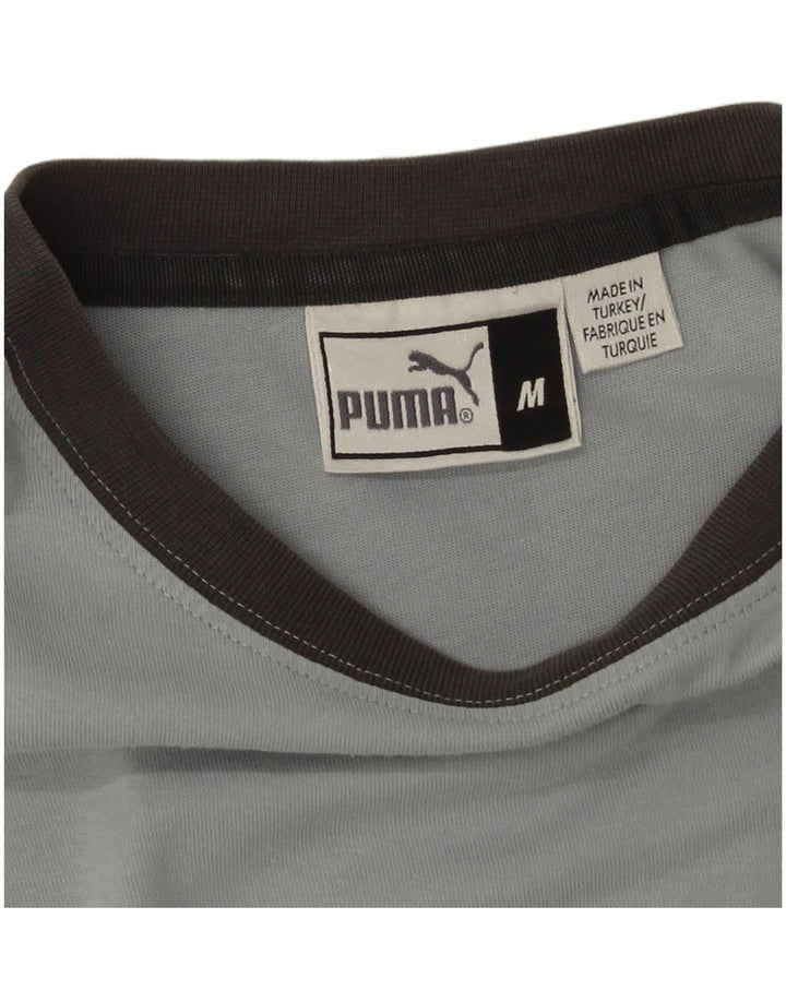 Damska koszulka z grafiką Puma Top UK 14 w kolorze średnioniebieskim