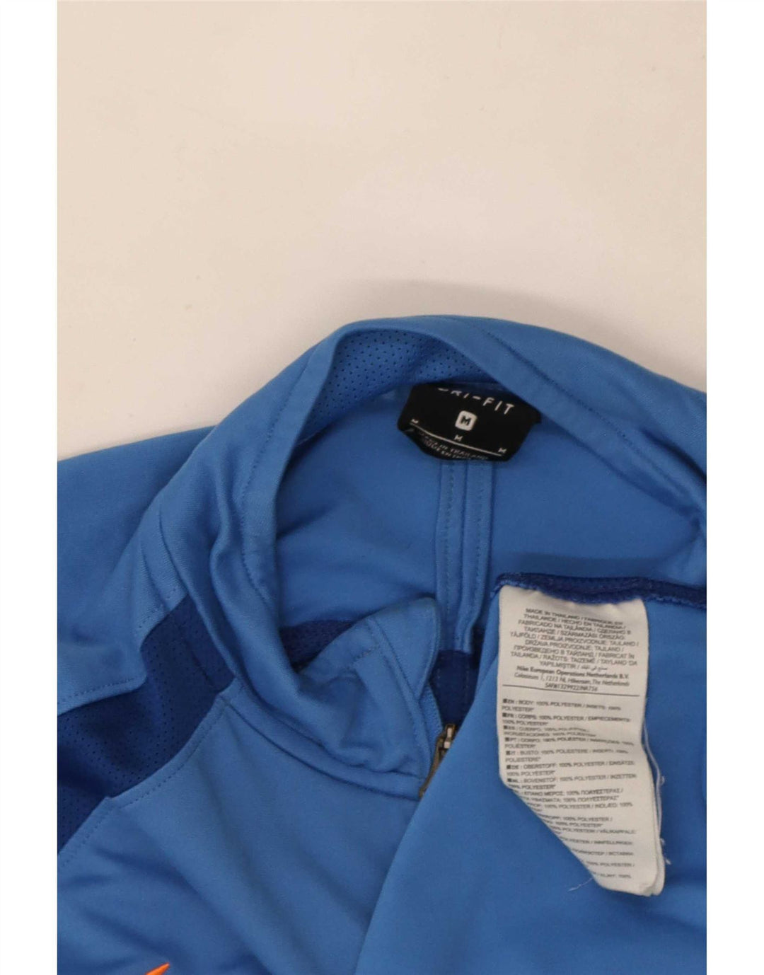 Męski dres Nike Dri Fit z zamkiem błyskawicznym na szyi i średnim niebieskim kolorem
