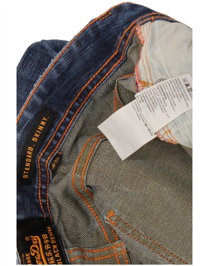 SUPERDRY Męskie jeansy obcisłe o standardowym kroju W34 L32 Niebieskie bawełniane