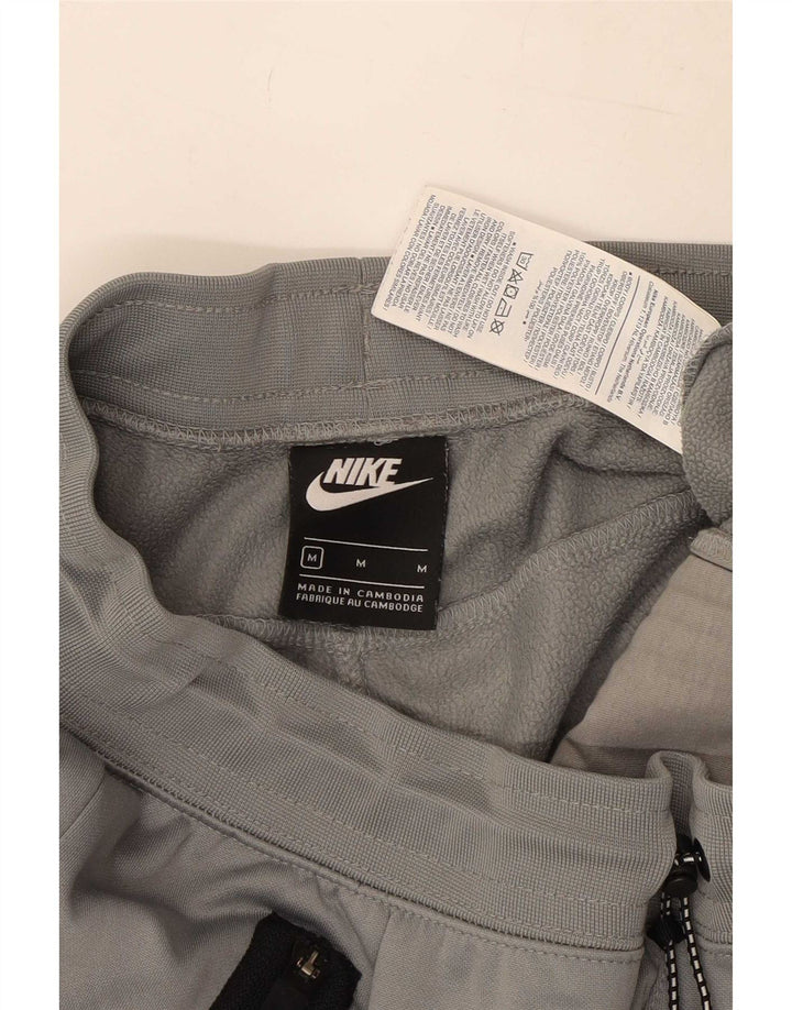 Męskie spodnie dresowe Nike Joggery, poliester w kolorze średnioszarym