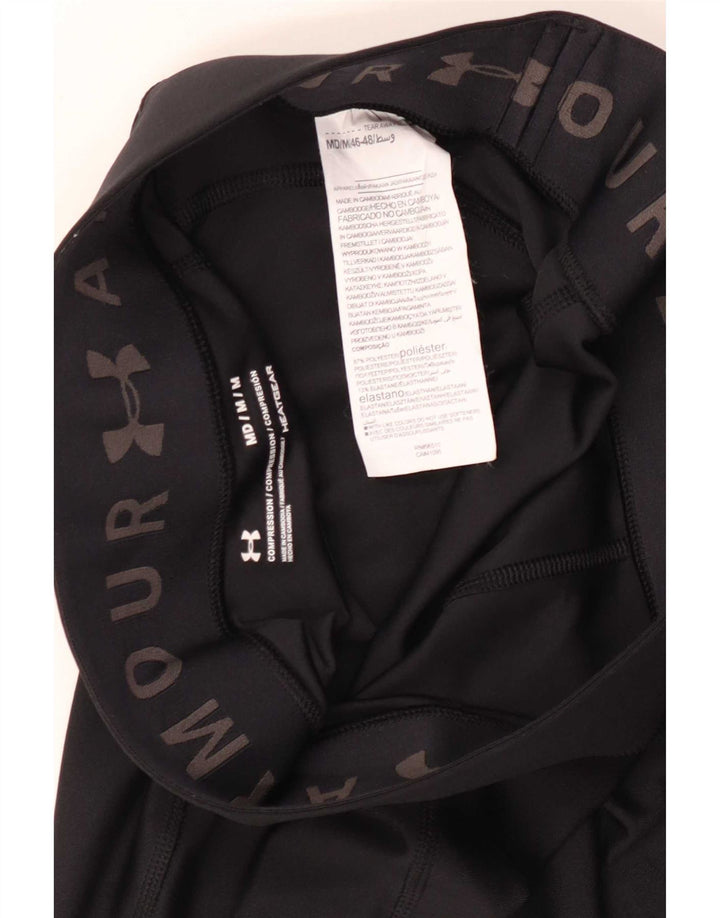 Damskie legginsy Under Armour Heat Gear Capri UK 12, średni czarny poliester